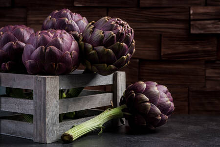 Purple artichokes in a box