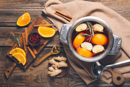 Pot with mulled wine on the table