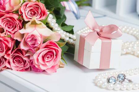 Box with pink ribbon and roses