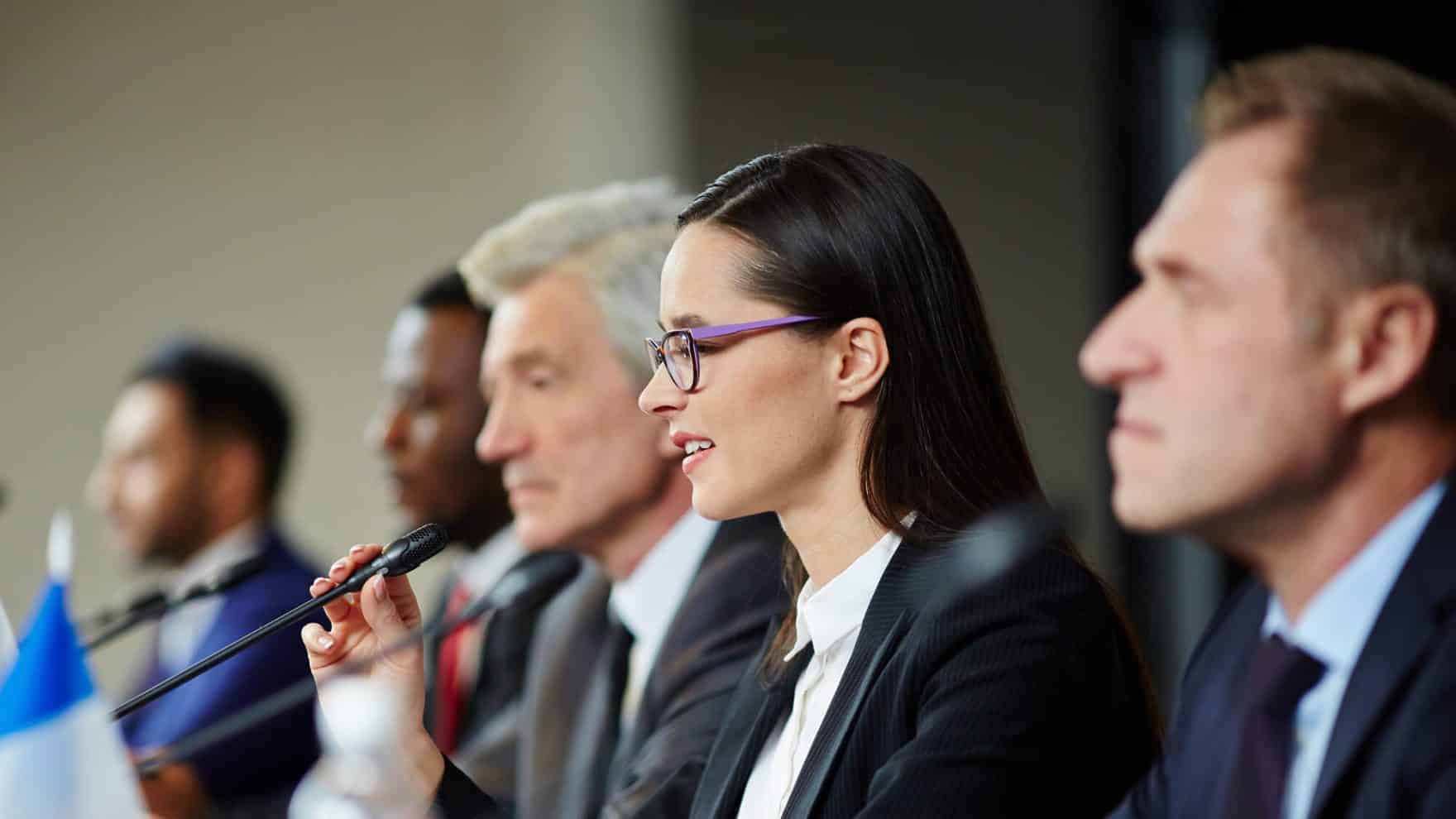 Delegates at a conference: Explore the certificate in international relations at Regent University.