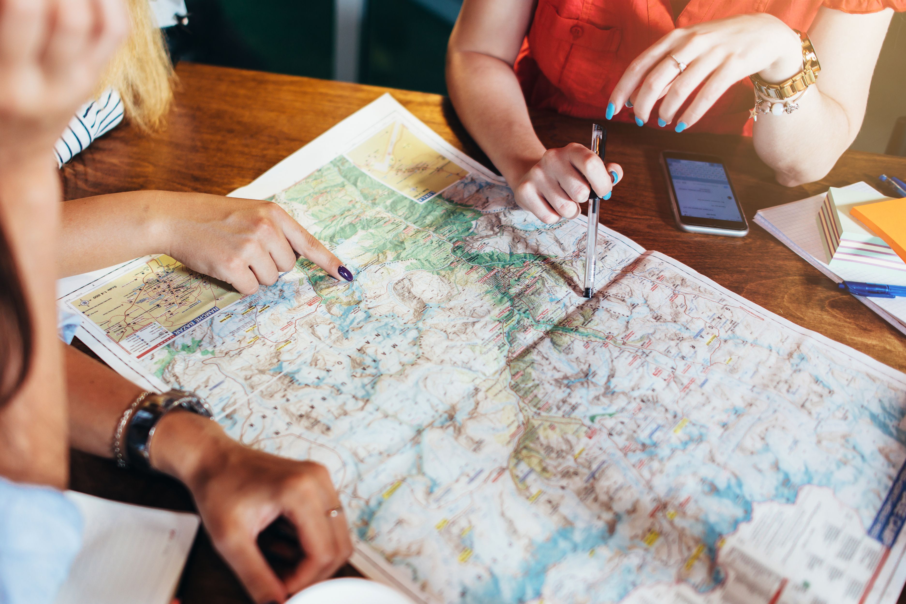 Female hands pointing at map | Image Credit: undrey - stock.adobe.com