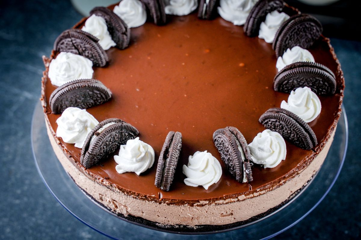 top of chocolate cheesecake with cookies and whipped cream