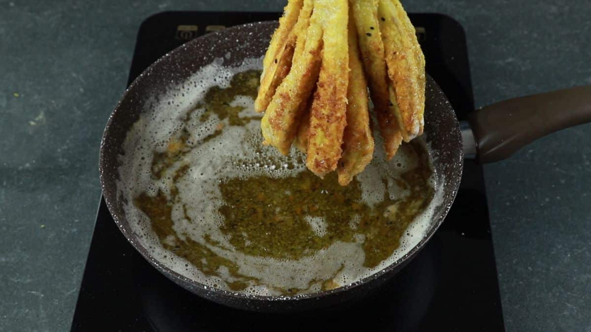 eggplant being lifted out of hot oil