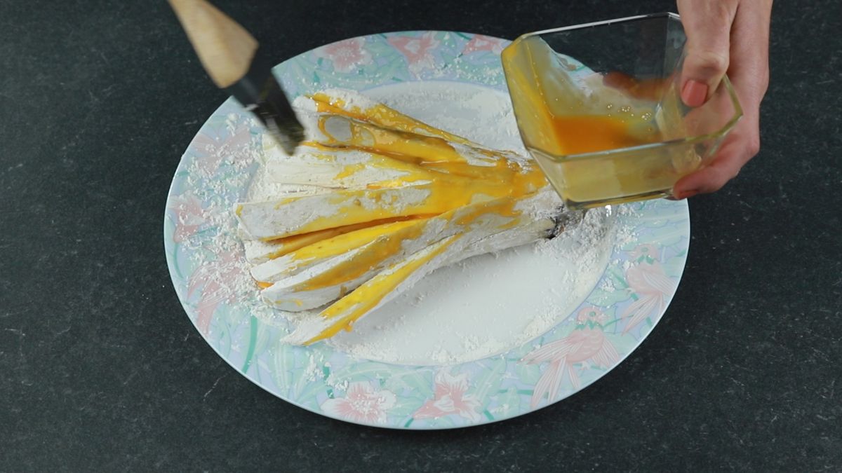 eggplant being coated in corn starch