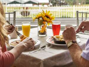 two people eating breakfast