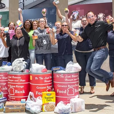 BBQGuys staff celebrating donations by jumping