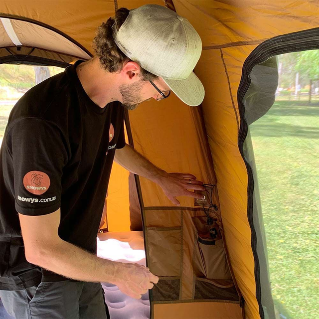 Coleman Instant Up 10P Lighted Northstar Darkroom Tent  &minus; Snowys team member turning the light power on in the tent