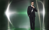 Jim Parsons in a black suit and a hand in his pocket wallpaper 1920x1200 jpg