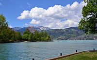 Fluffy clouds over the mountains wallpaper 2560x1600 jpg