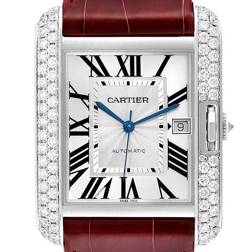 The image shows a close-up view of the face of the Tank Anglaise model by Cartier, featuring Roman numerals, blue hands, a date window, and a leather strap.