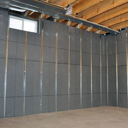 Insulated basement wall panels with built-in studs.