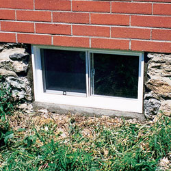 Outside view of a vinyl basement window system