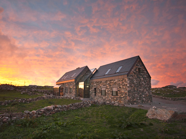 Two Stone Cottages Connected by a Glass Staircase