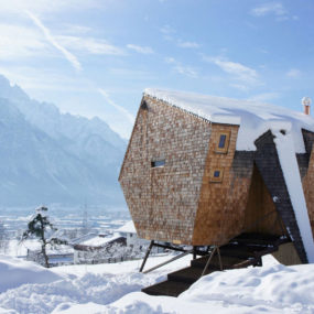 Wood Shingled Austrian Mountain House with Sloped Walls