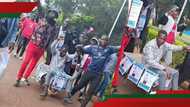 Moi University student cracks up netizens after campaigning on a wheelbarrow: "Hustler in chief"