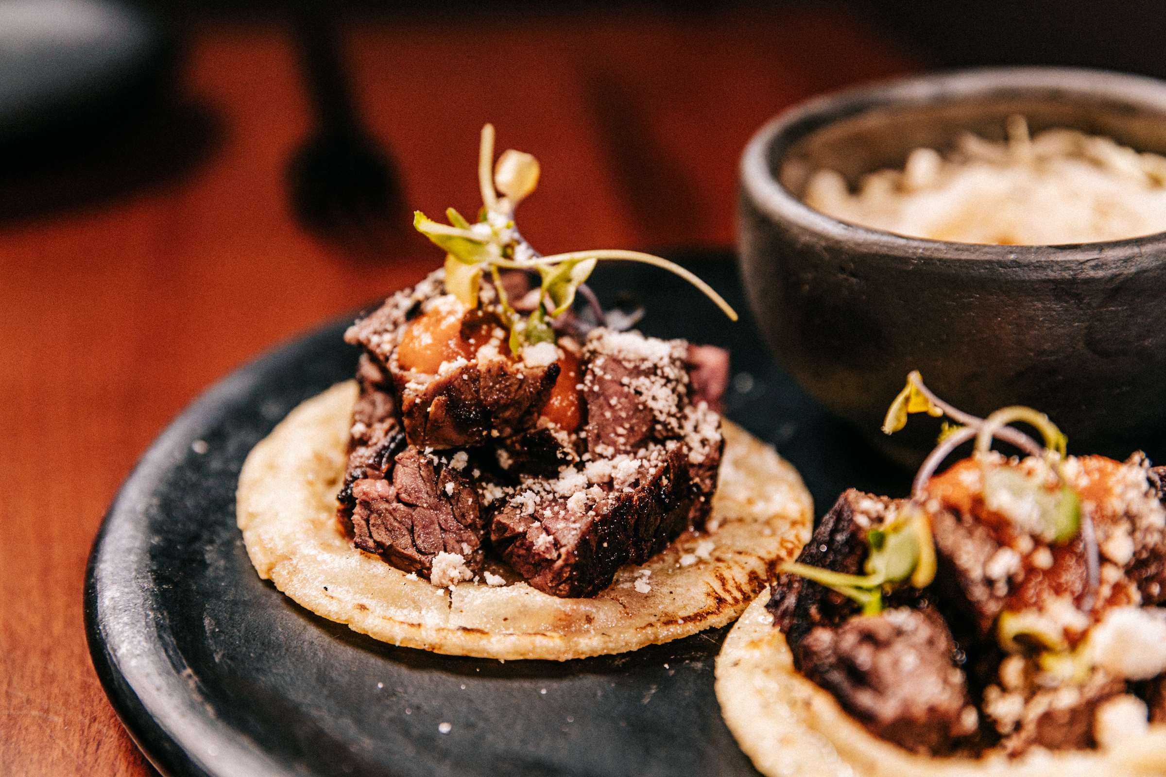 A close-up of beef on a tortilla.