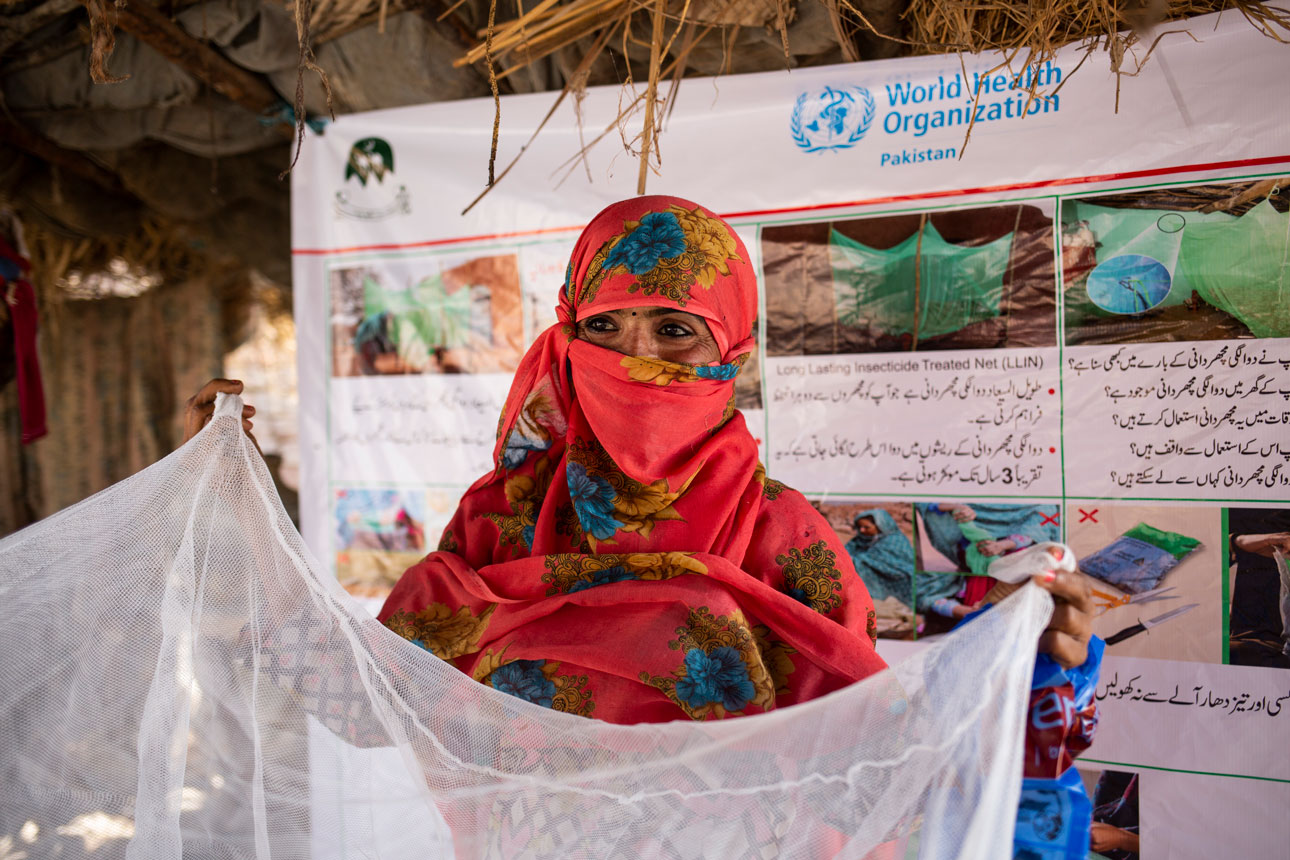 Woman holding an insecticide-treated net