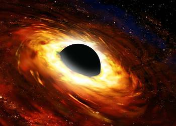 Supermassive black holes are found at the center of galaxies, chomping on gas and dust that gets pulled into their strong gravitational field. They are surrounded by a hot, swirling accretion disk of material.