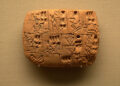 An ancient clay tablet with proto-cuneiform writing.