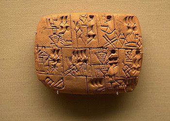 An ancient clay tablet with proto-cuneiform writing.