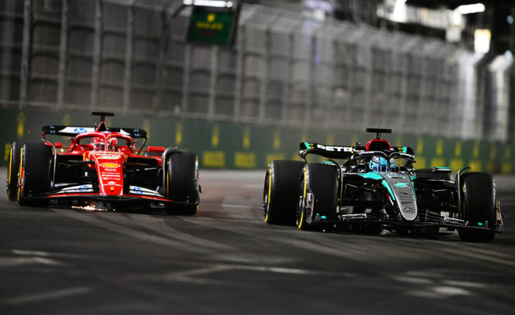 George Russell of Great Britain driving the (63) Mercedes AMG Petronas F1 Team W15 leads Charles Leclerc of Monaco driving the (16) Ferrari SF-24 d...