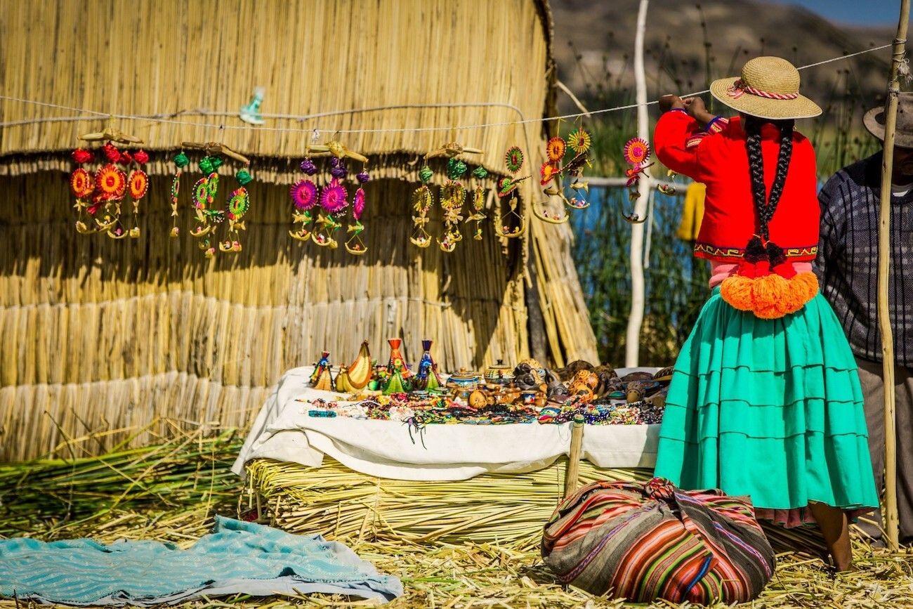 Local woman on the Uros Island displaying art and craft creations