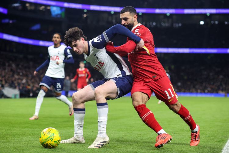 Archie Gray of Tottenham Hotspur keeps Mohamed Salah of Liverpool from the ball during the Carabao Cup Semi Final First Leg match between Tottenham...