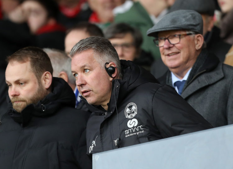 Peterborough United Manager Darren Ferguson (C) looks on in the stands with his father Sir Alex Ferguson behind him during the Sky Bet League One m...