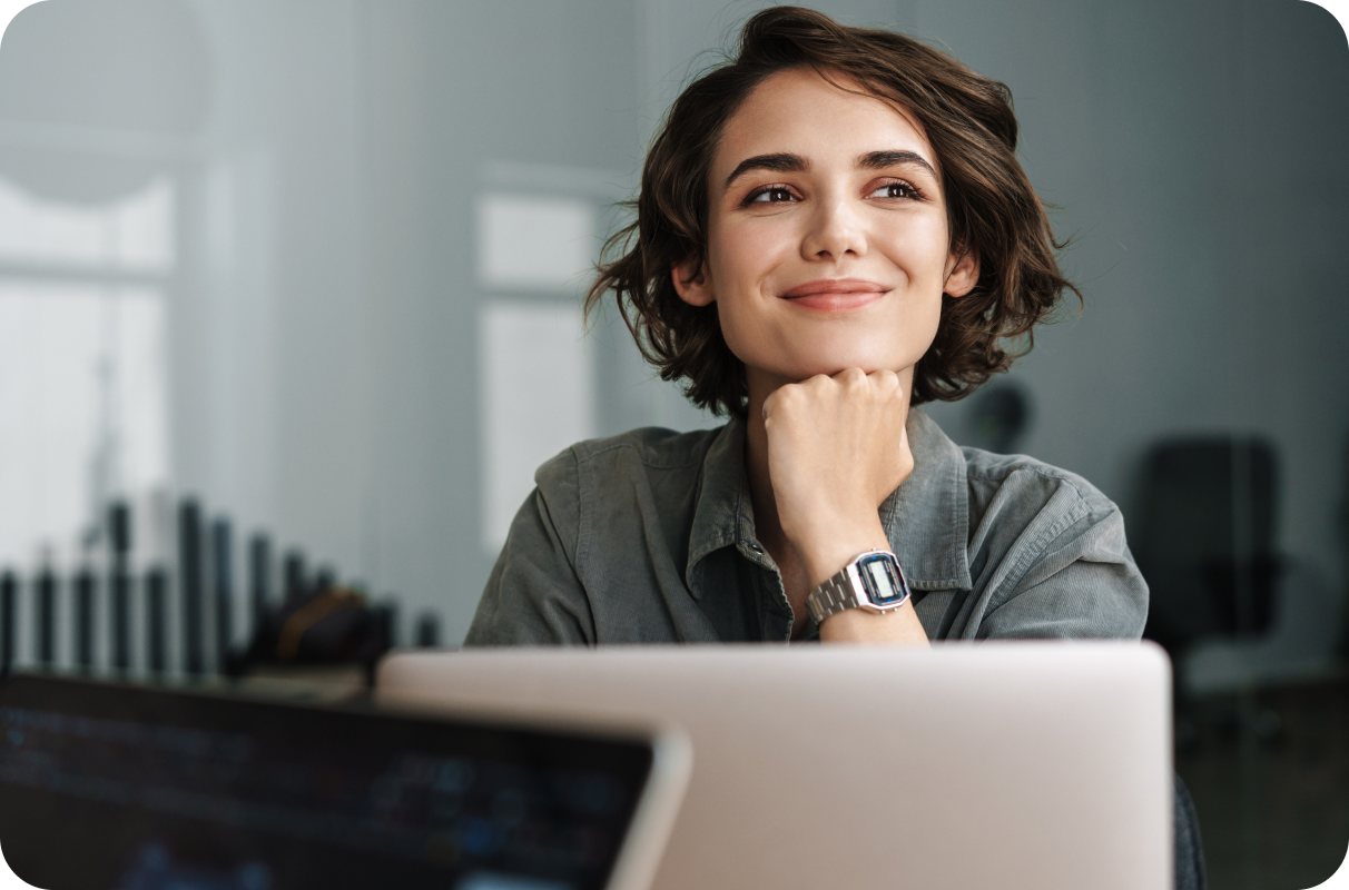 Person sitting at computer and thinking