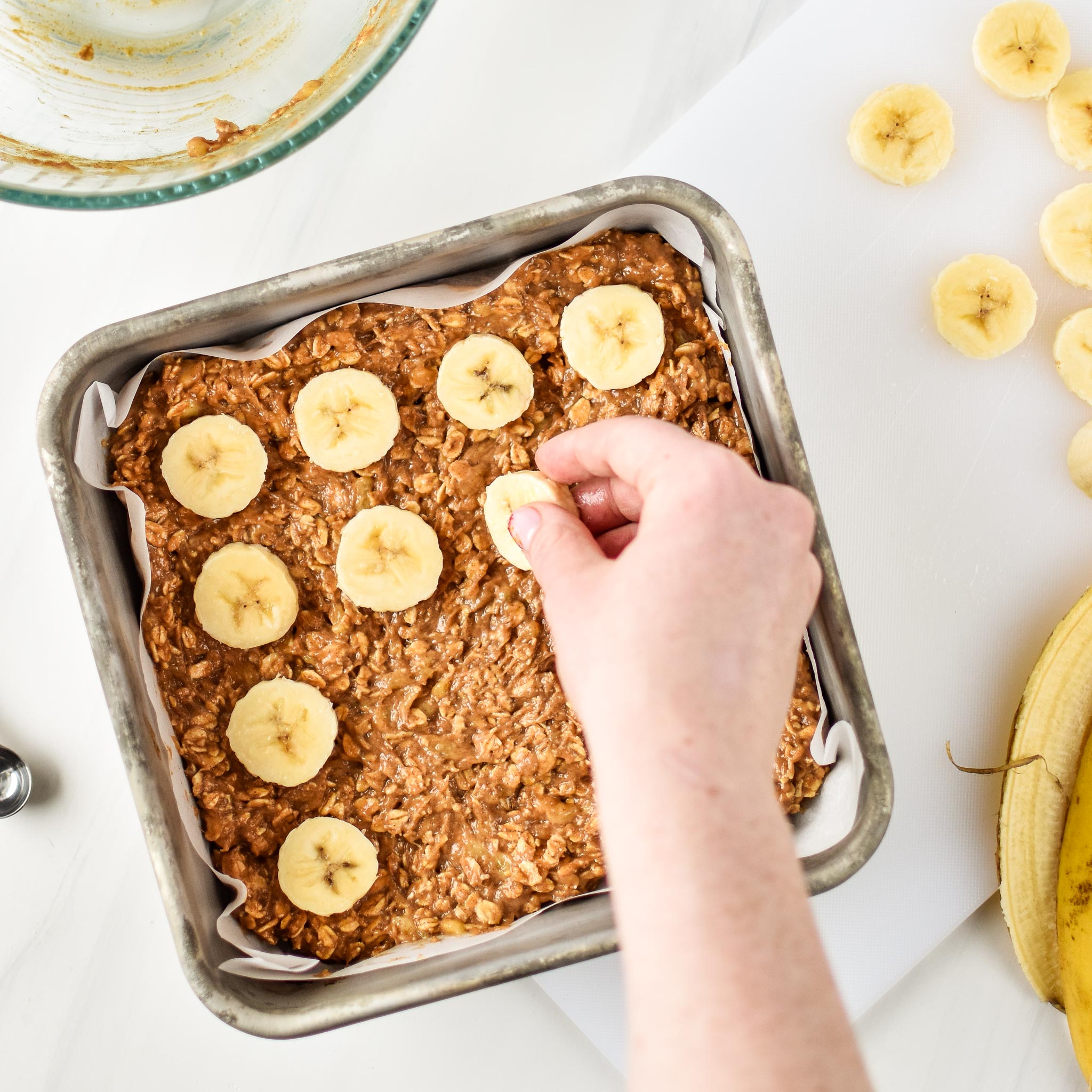 Adding sliced bananas to the PB Banana Oatmeal Breakfast bars