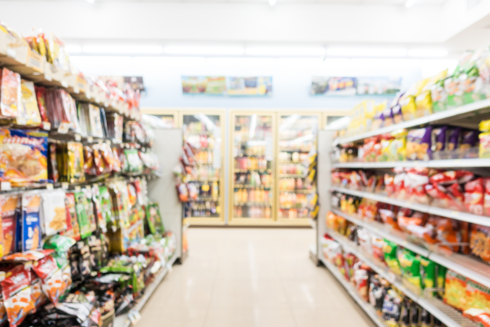 blurry convenience store aisle showing promotional tie-ins