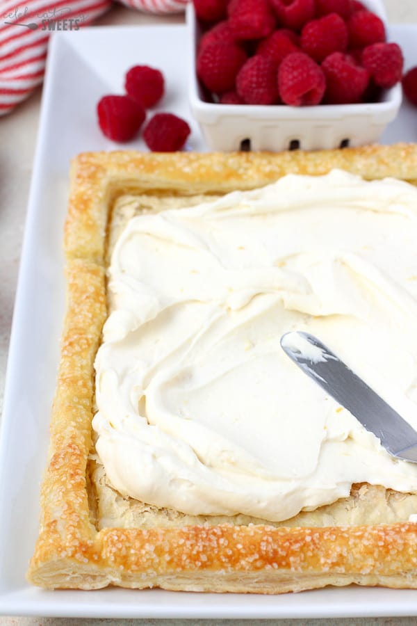 Lemon Cream Cheese Filling being spread into a Puff Pastry crust.