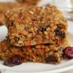 Two breakfast bars stacked on top of each other on a white plate.