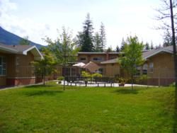 commercial exterior painting of Queen Victoria Hospital in Revelstoke