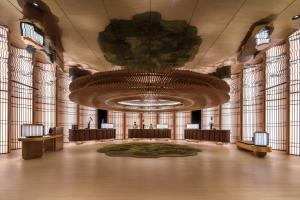 a large hall with a large chandelier and a large room at PARKROYAL COLLECTION Marina Bay, Singapore in Singapore