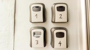 a set of four key controls on a door at Bascarsija Guesthouse - Private Bath, TV & AirCon in Sarajevo