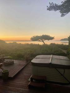 a wooden deck with a view of the ocean at Siletz Bay Beach House in Lincoln City