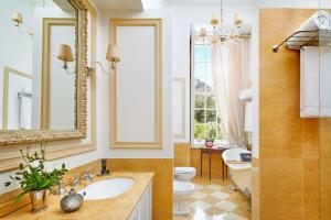 a bathroom with a sink and a toilet and a mirror at Valverde Sintra Palácio de Seteais - The Leading Hotels of the World in Sintra