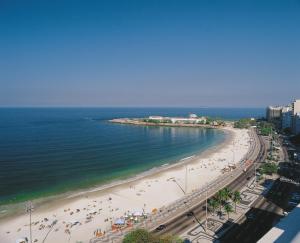 an aerial view of a beach with people on it at Miramar By Windsor Copacabana in Rio de Janeiro