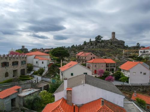 a view of a town with red roofs at Casas da Lagariça in Sortelha