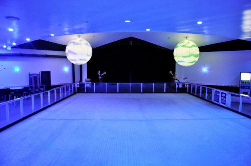 a dance floor with two lights in a room at Paradise Resort Gold Coast in Gold Coast