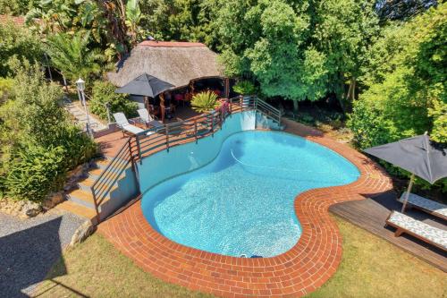 an overhead view of a swimming pool in a yard at Villa Helderberg in Somerset West