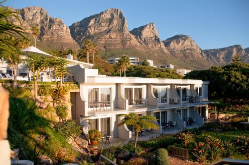 a view of a hotel with mountains in the background at Ocean View House in Cape Town