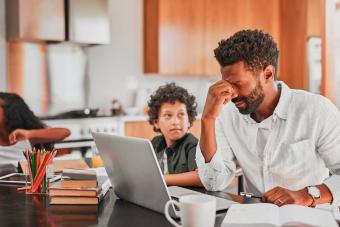 stressed man using his laptop 