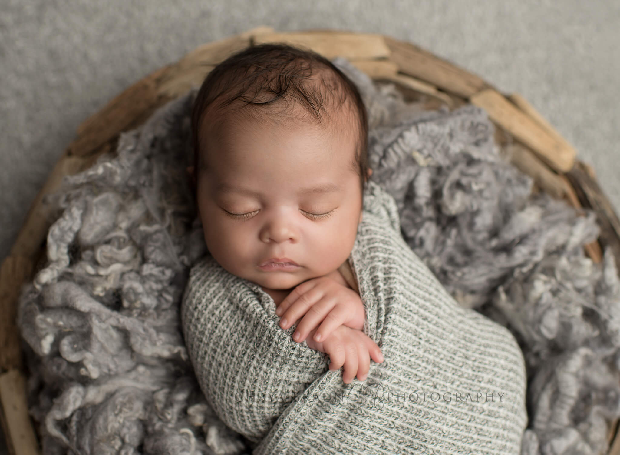 newborn baby in a basket