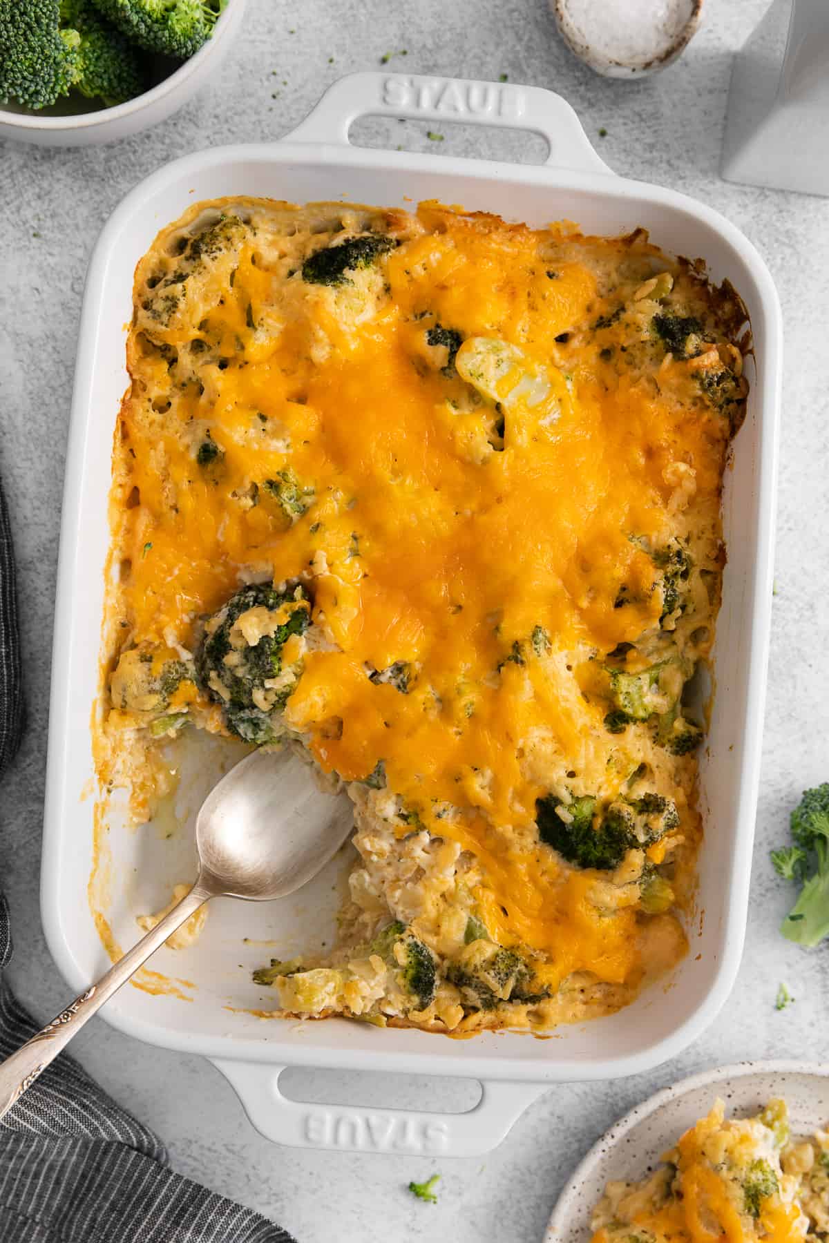 Broccoli cheese casserole in a casserole dish.