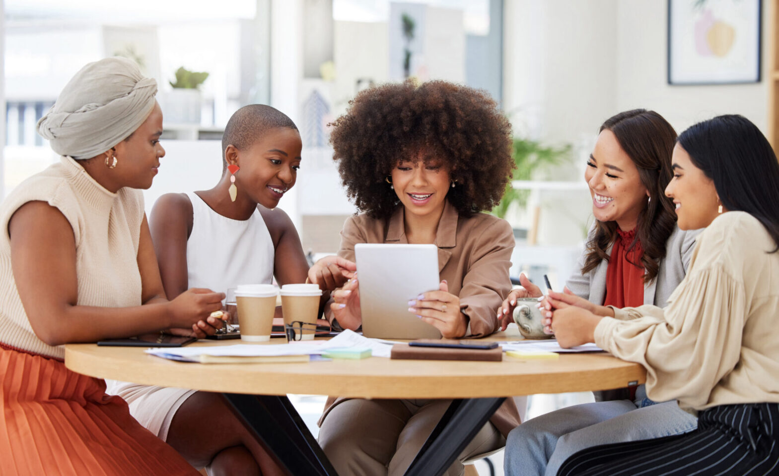 Business women at a meeting table.