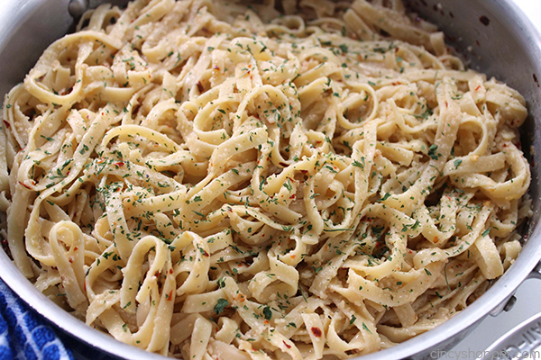 Garlic Parmesan Noodles - perfect side dish with just about any meal. Butter, garlic, noodles, Parmesan, and a few minutes of time needed are all that are needed.