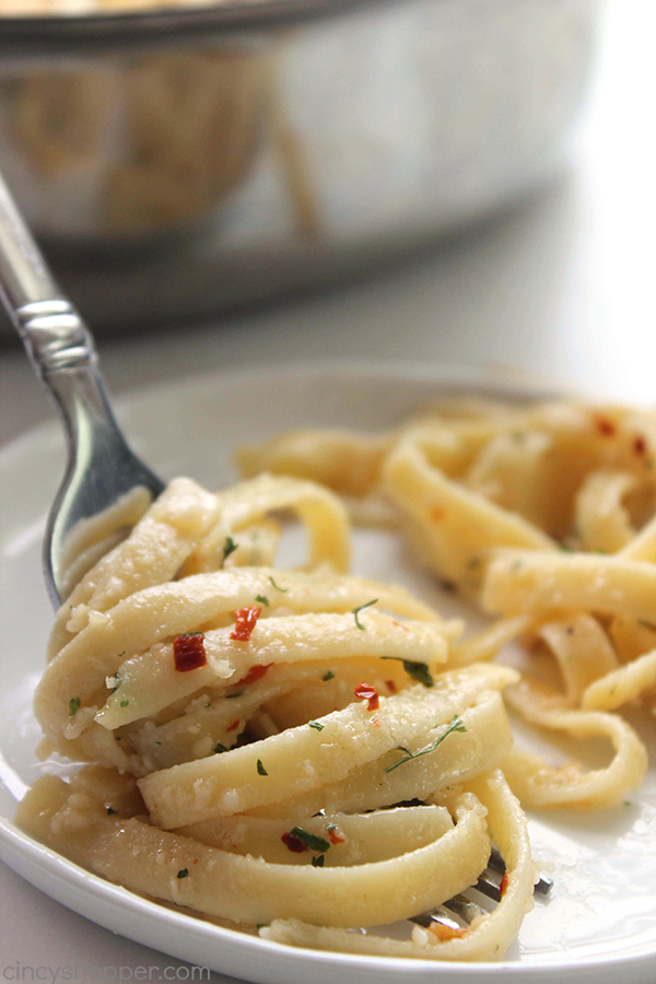 Garlic Parmesan Noodles - perfect side dish with just about any meal. Butter, garlic, noodles, Parmesan, and a few minutes of time needed are all that are needed.