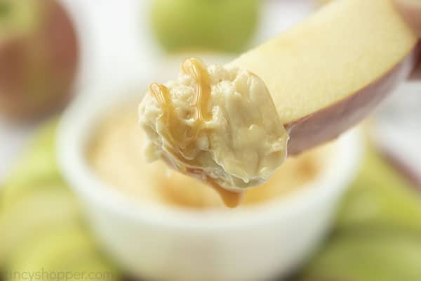 Caramel dip on apple slice